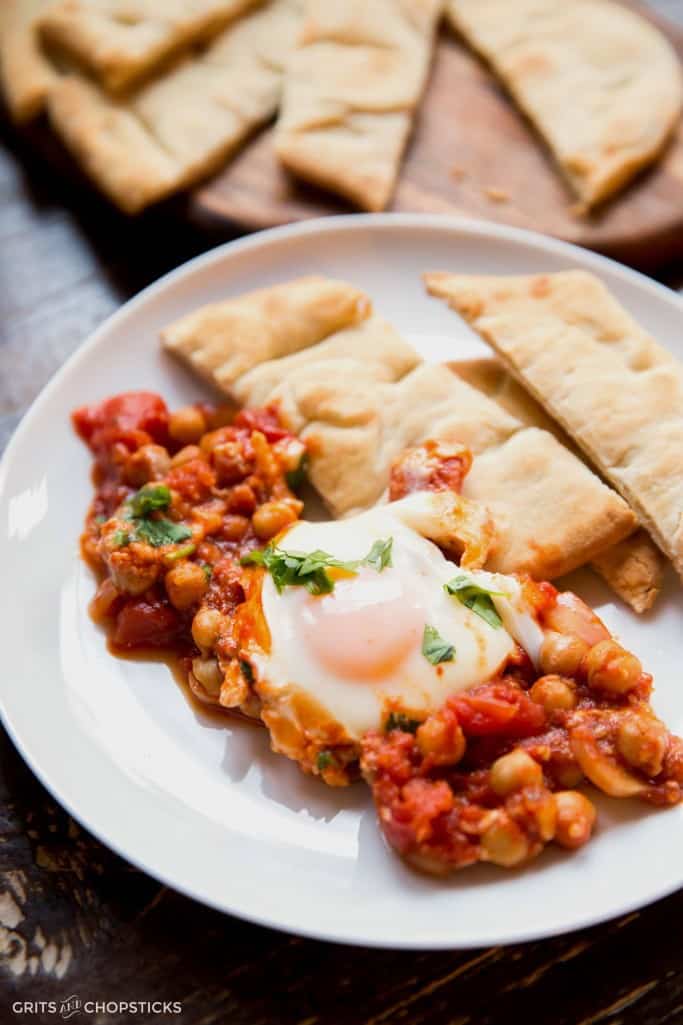 This recipe calls for poached eggs to simmer in a rich tomato sauce with feta, eggplant and chickpeas. Also known as shakshuka, it's a perfect healthy meal for any time of the day (breakfast included)!