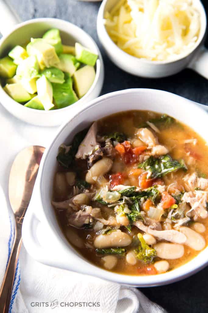This recipe for slow cooker chicken and white bean chili with cannelini beans, tomatoes and broccoli rabe is a great comfort dinner meal for winter!