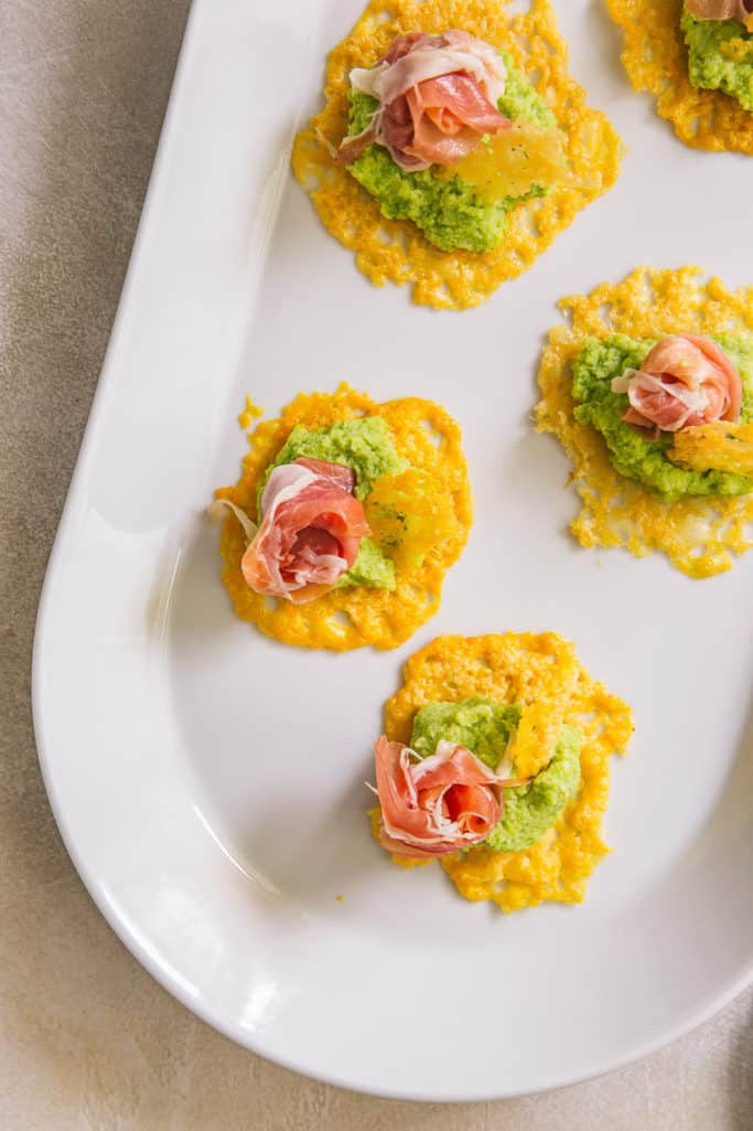 try these grana padano cheese crisps with prosciutto and fava bean pate for your next dinner party and wow your guests!